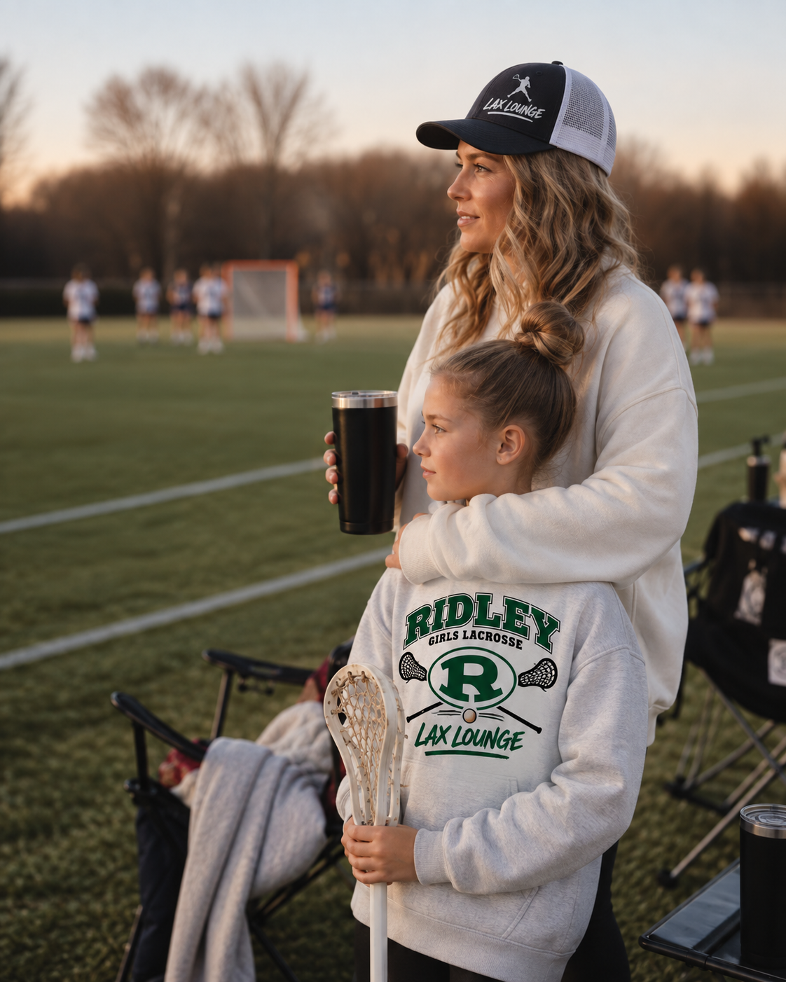 A lacrosse family on the sideline in Lax Lounge fleece